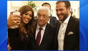محمود عباس و مجری زن